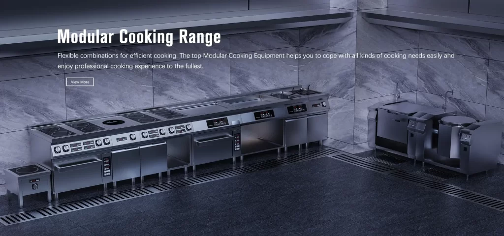 A stainless-steel modular cooking range setup with various appliances in a commercial kitchen environment. A wall-mounted screen displays "Modular Cooking Range" with a brief description, making it feel as efficient and organized as a professional chef's home kitchen.