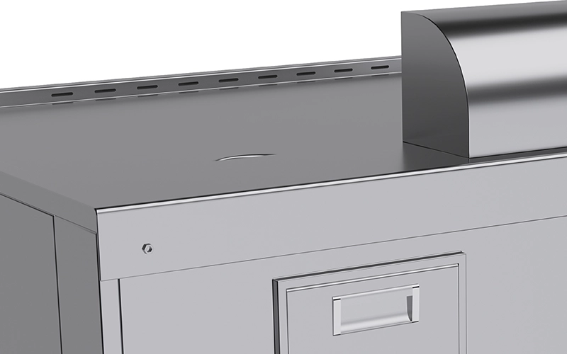 Close-up view of a gray metal filing cabinet with a partially visible drawer and a raised, curved section on top, resembling the sleek surfaces often found in teppanyaki cooking setups.