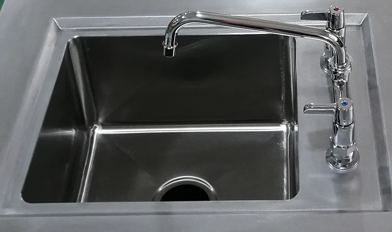 Commercial Stainless Steel Sink High-efficiency sink designed for durability and efficient kitchen cleaning.