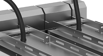 Close-up view of a commercial clamshell griddle, showing metal components and heating elements used for efficient cooking in commercial kitchen settings.