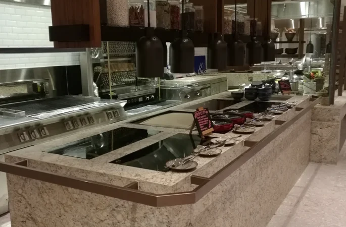 Commercial built-in induction cooker installed in a modern restaurant kitchen